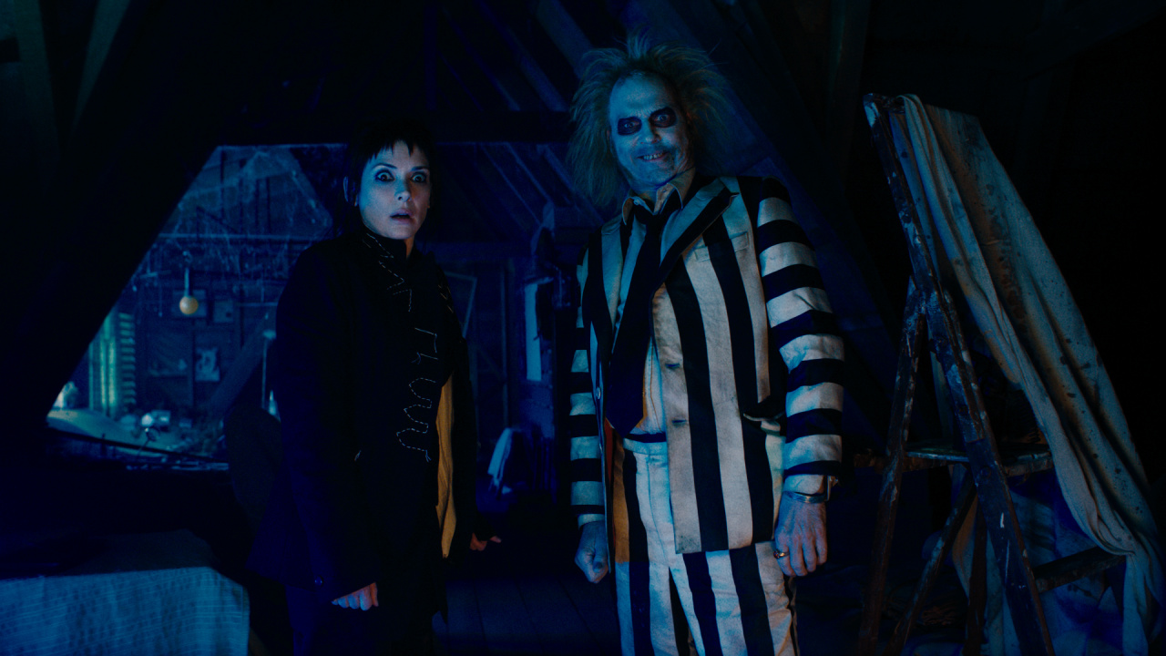 (L to R) Winona Ryder as Lydia and Michael Keaton as Beetlejuice in Warner Bros. Pictures' comedy, 'Beetlejuice Beetlejuice,' a Warner Bros. Pictures release. Photo Credit: Courtesy of Warner Bros. Pictures. Copyright: © 2024 Warner Bros. Entertainment Inc. All rights reserved