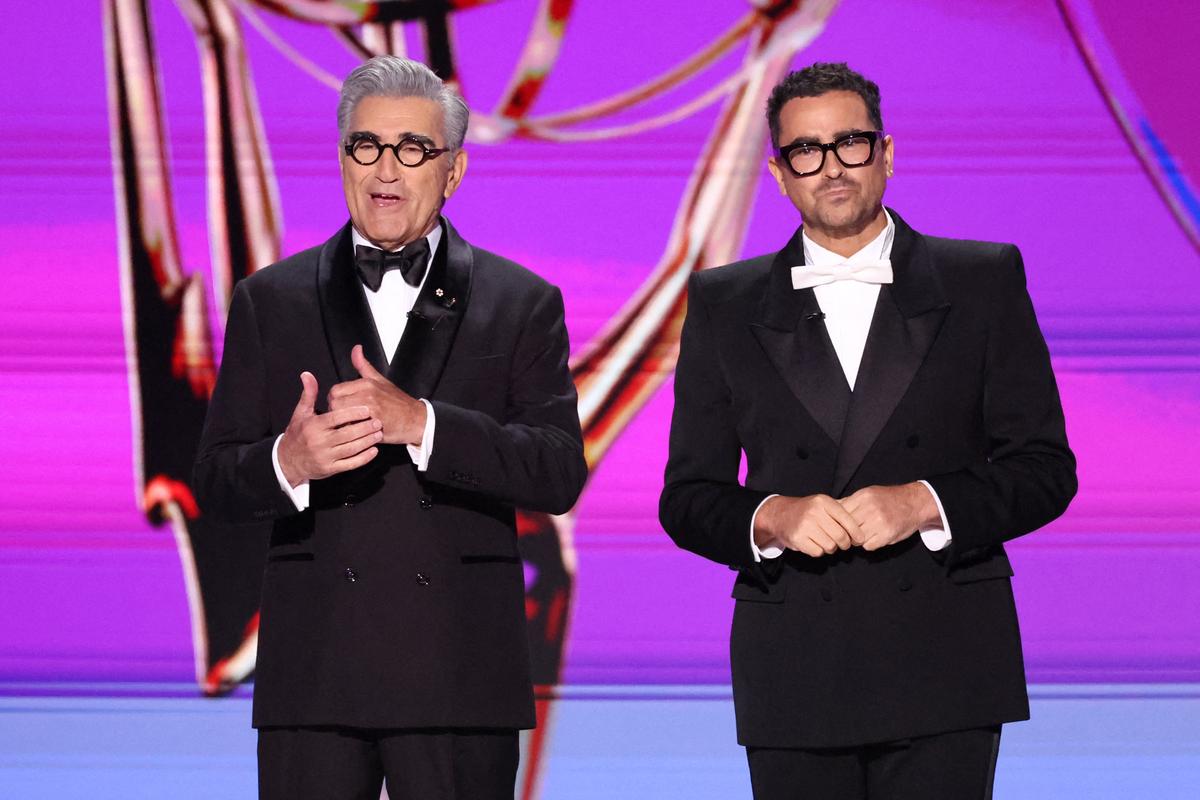 Eugene Levy and Dan Levy speak on stage at the 76th Primetime Emmy Awards