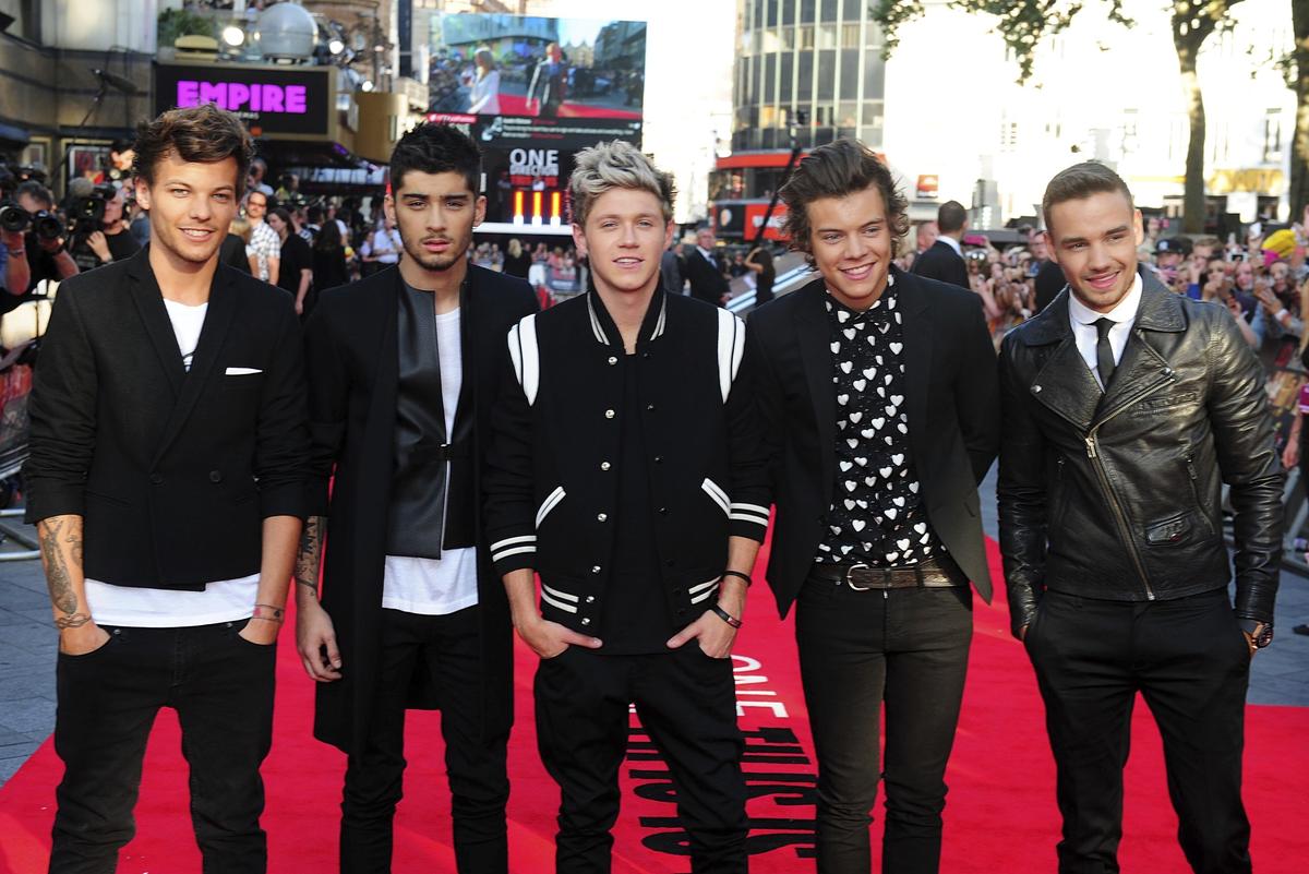 FILE - Louis Tomlinson, from left, Zayn Malik, Niall Horan, Harry Styles and Liam Payne at Empire Leicester Square in London on August 20, 2013 